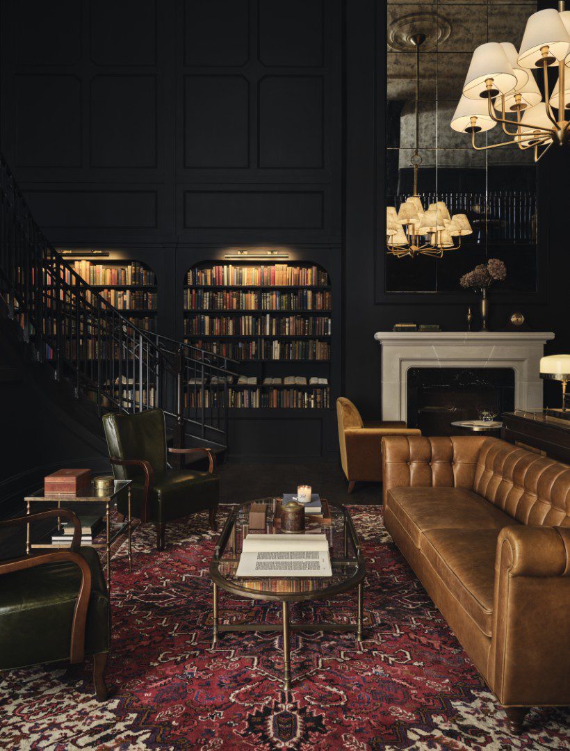 Hotel 1928 library with couch and fireplace