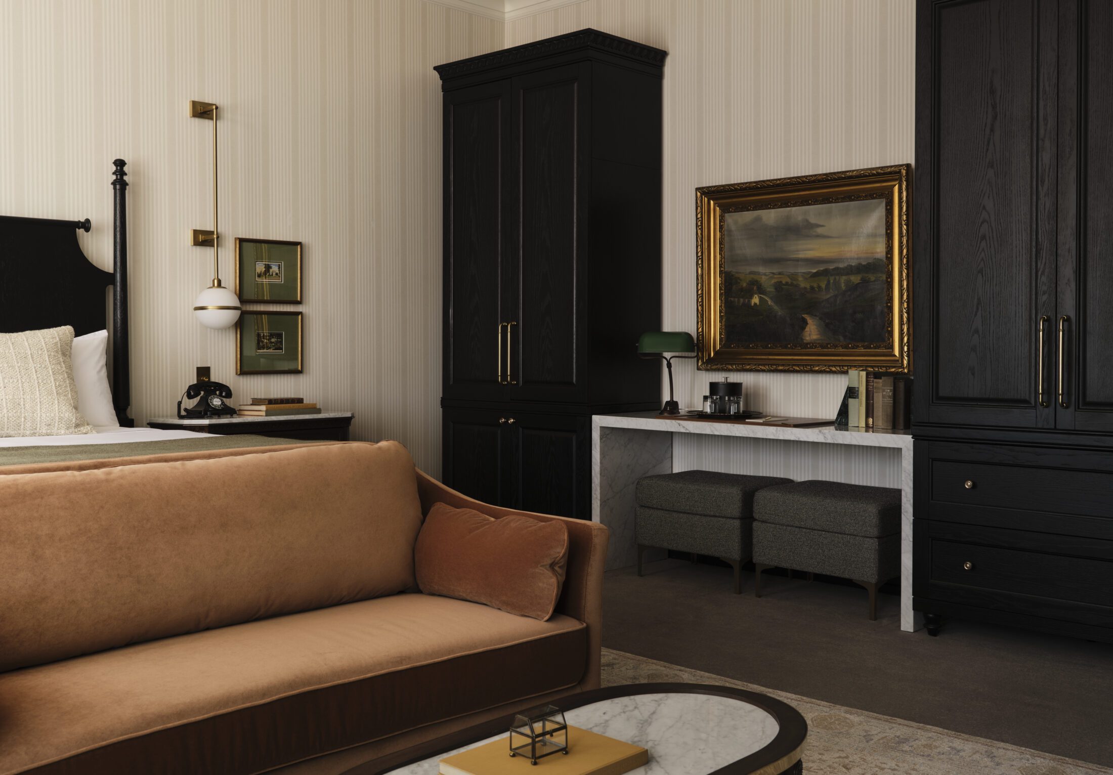 Hotel room with bed, art, and cabinetry